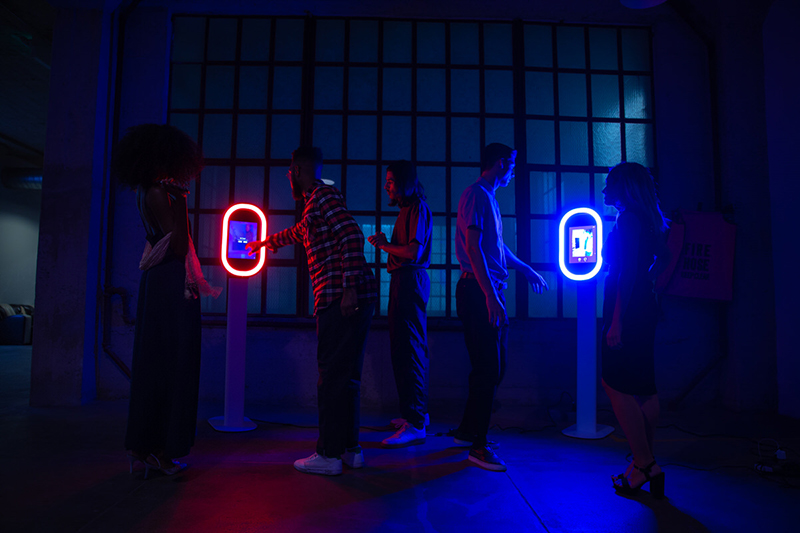 Neon-lit photo booths ready for guests