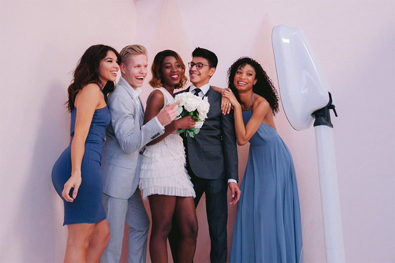 Wedding party posing with the photo booth